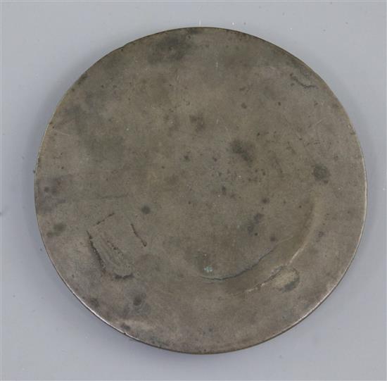 A small Chinese bronze circular mirror, Tang dynasty, 7th-9th century A.D., 10cm diameter, curved split